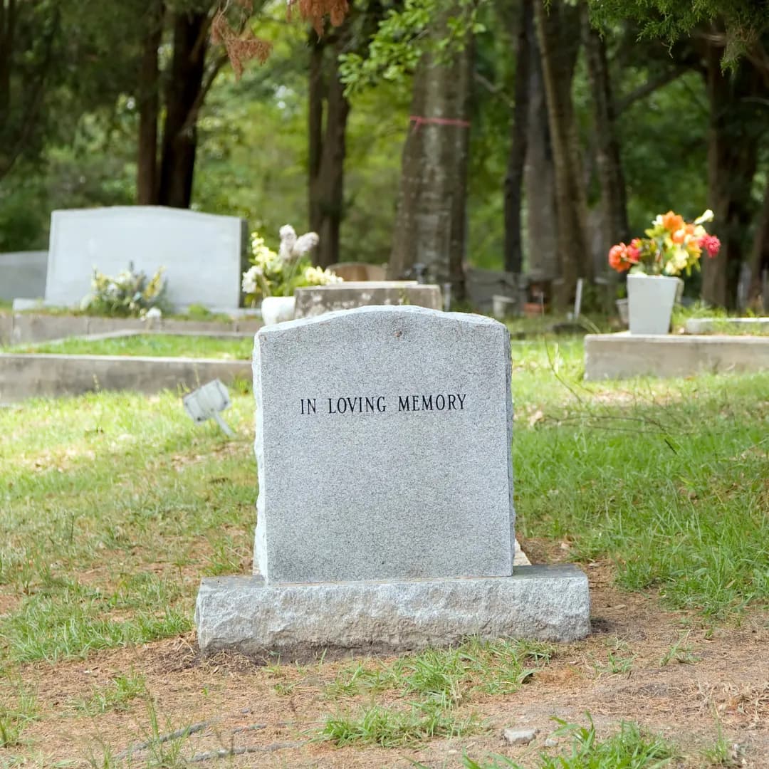 Classic upright headstone engraved In Loving Memory